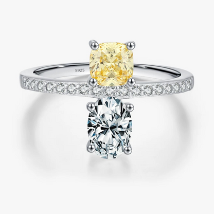 Silver ring with two diamonds on a white background