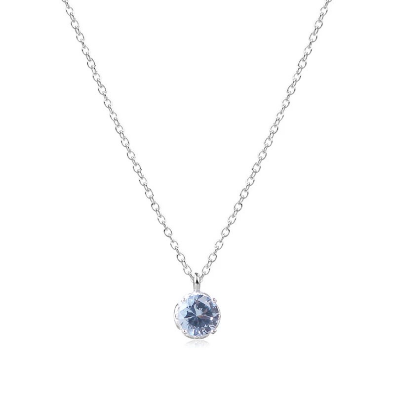 Silver necklace with a blue gemstone pendant on a white background