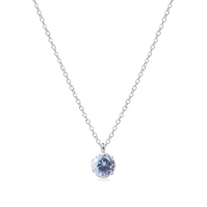 Silver necklace with a blue gemstone pendant on a white background