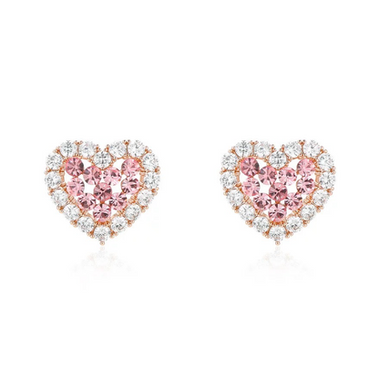 Heart-shaped pink gemstone earrings with rose gold and clear gemstones on a white background