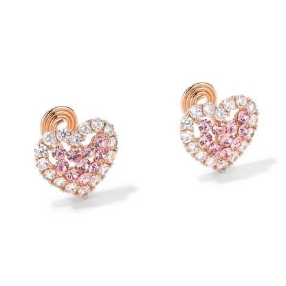 Heart-shaped earrings with pink and clear gemstones on a white background