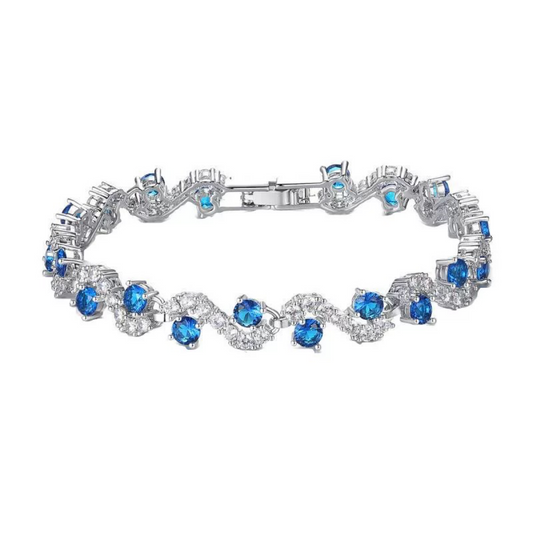 Silver bracelet with blue gemstones on a white background