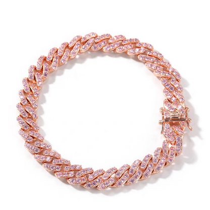 Rose gold bracelet with pink gemstones on a white background