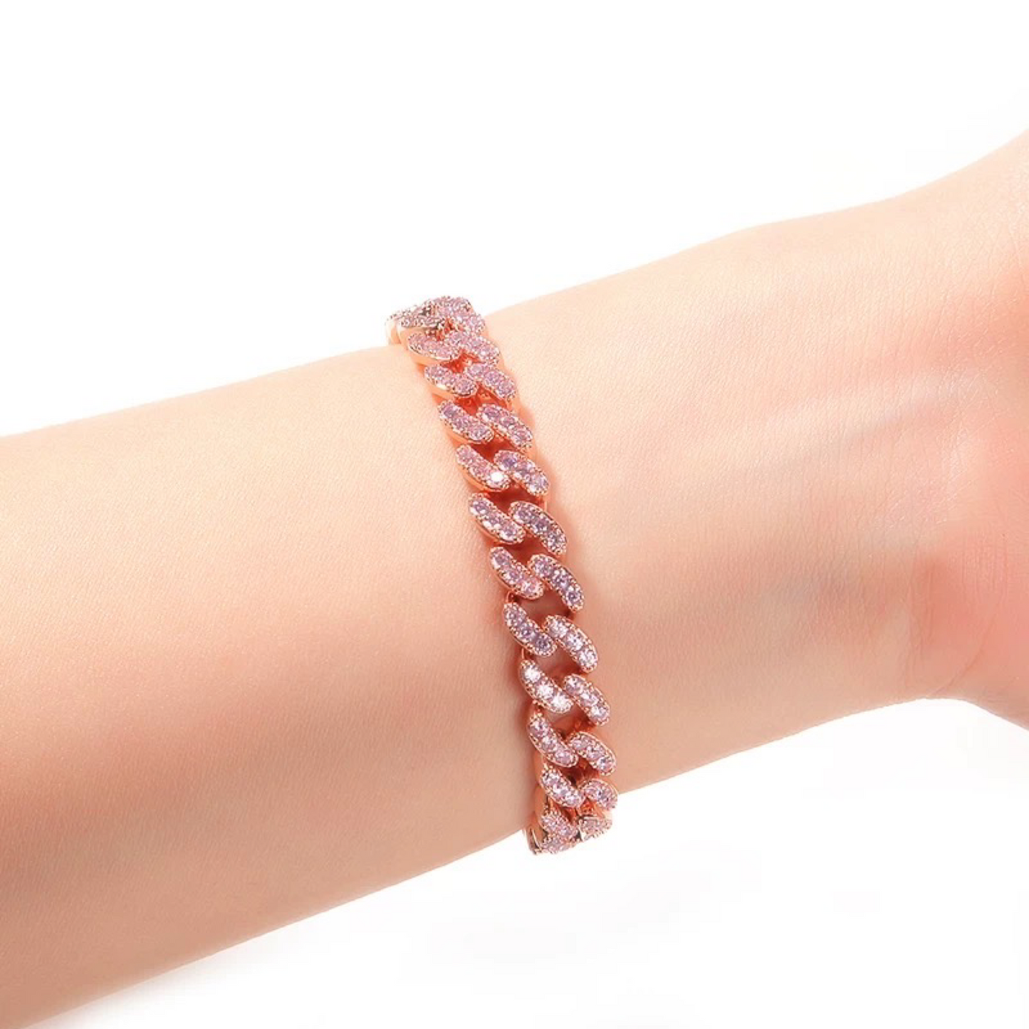 Bracelet with pink gemstones on a wrist against a white background