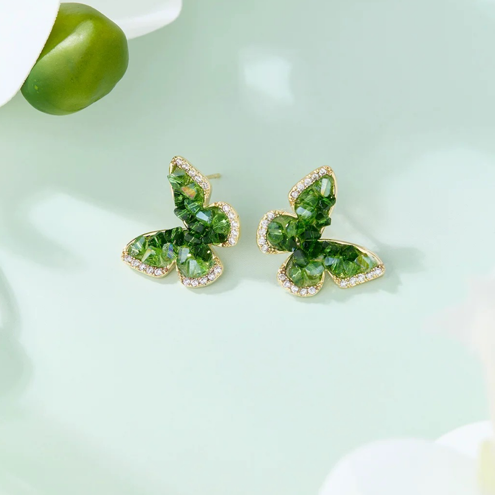 Emerald Green Crystal Butterfly Earrings Clip-On Stud Women Summer 2025 by ASTRALOOM on light background